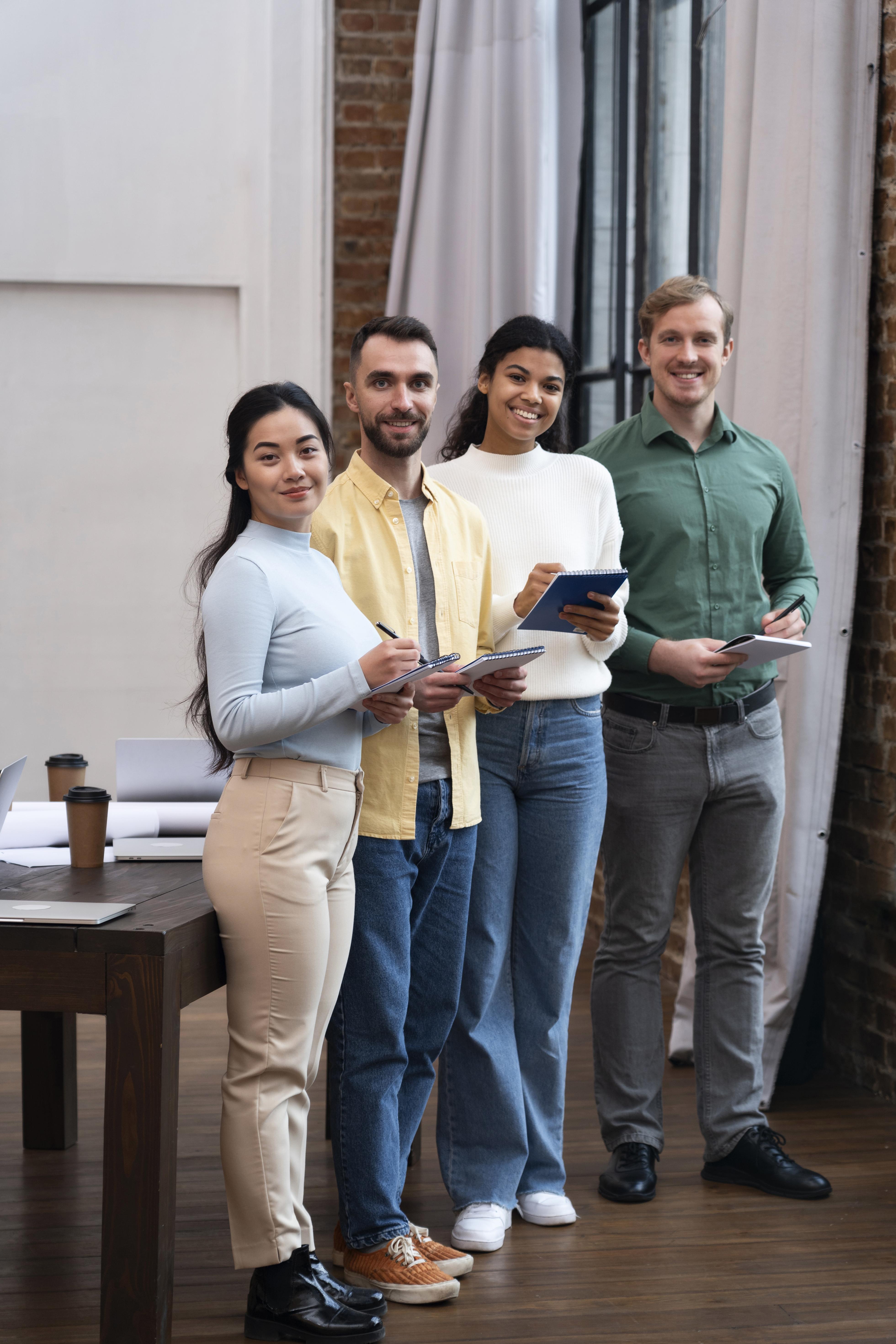 Team of professionals standing together in a modern office